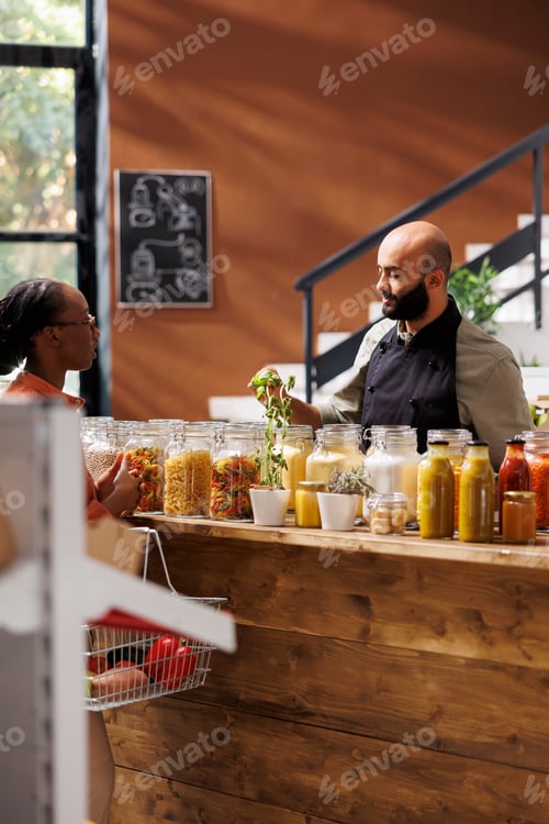 Preview: Woman conversing with store worker