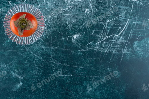 Preview: Tasty ripe persimmon on glass plate
