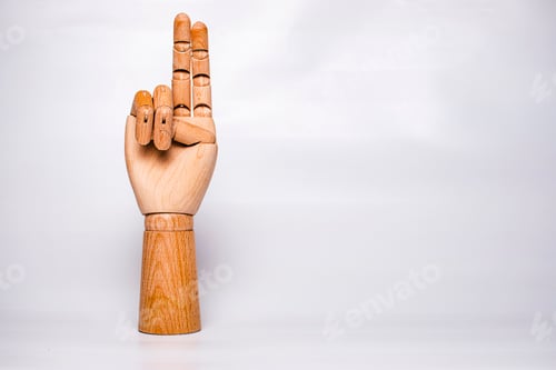 Preview: A wooden orthopedic hand on white background.