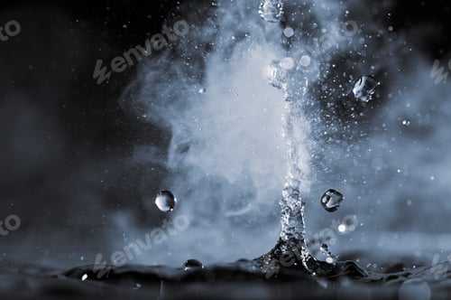 Preview: Boiling water splash with steam on black background closeup