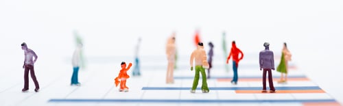 Preview: Concept of equality with plastic people figures on surface with graphs isolated on white, panoramic
