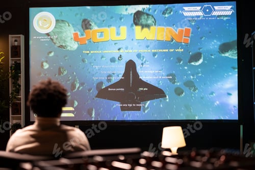Preview: Gamer watching online tutorial on TV made by content creator on how to win videogame