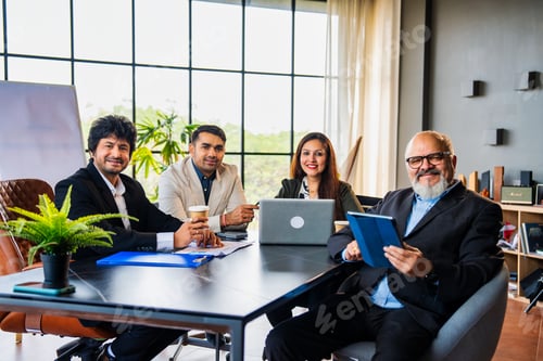 Preview: Indian asian Business professionals discussing ideas during a formal meeting in a conference room