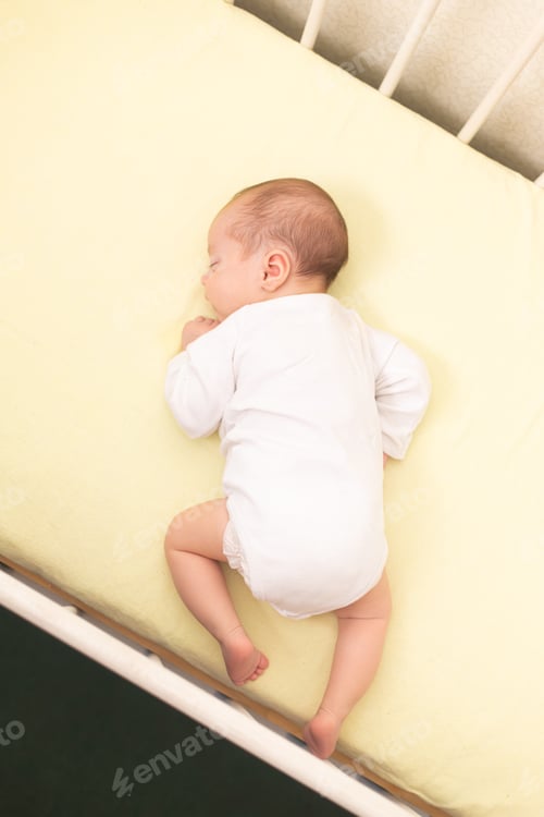 Preview: The baby is sleeping in his crib