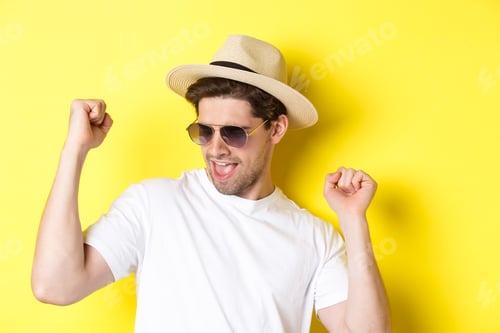 Preview: Concept of tourism and vacation. Close-up of man enjoying holidays on trip, dancing and pointing