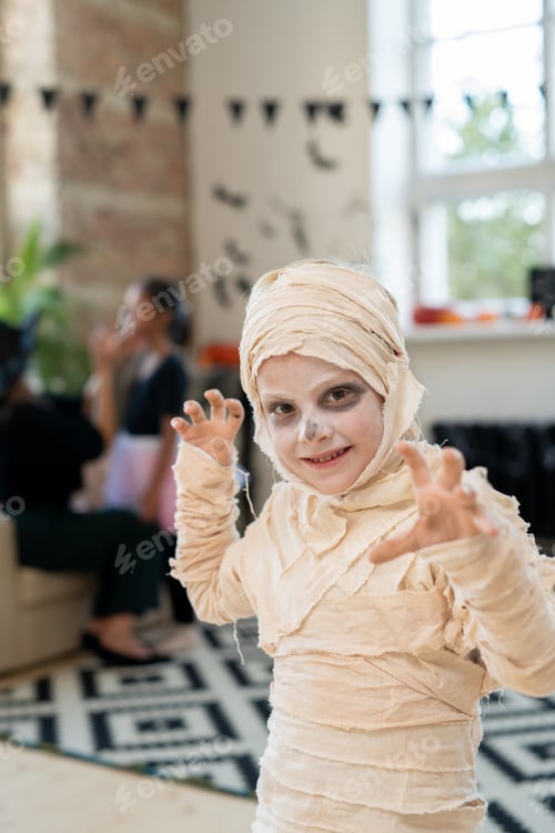 Preview: Portrait of mummy boy making boo gesture