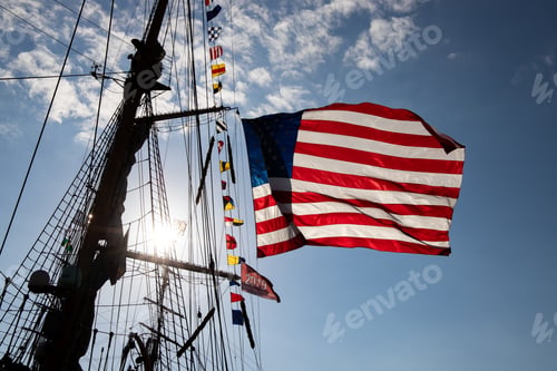 Preview: Low angle shot of the American flag on ship at sunlight