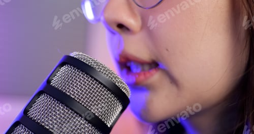 Preview: Close up view of young female gamer playing online game on computer