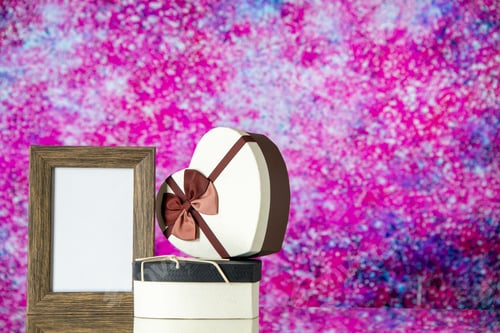 Preview: front view valentines day presents with picture frame on the light pink background passion marriage