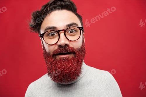 Preview: Young man with beard covered in glitter.