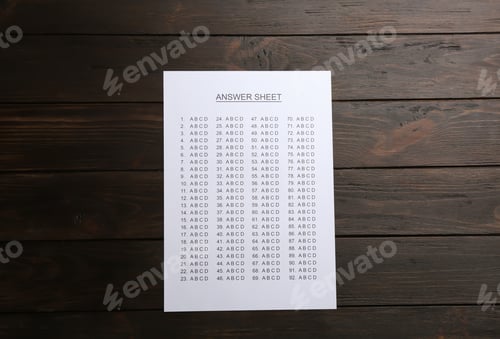 Preview: Answer sheet on wooden background, top view