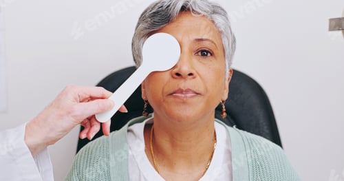 Preview: Doctor, optometry and portrait of woman in exam for eye care, hands and senior person with occluder