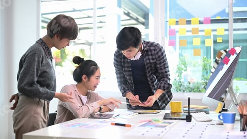 Preview: Group of creative designer people brainstorming and discussing new project plan in modern office.