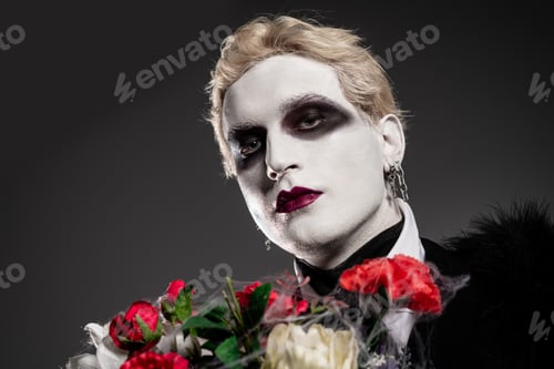 Preview: Handsome young man poses dramatically in stunning Halloween costume with roses