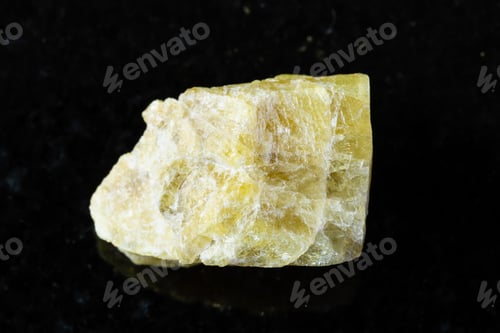 Preview: sample of raw yellow tourmaline mineral on black