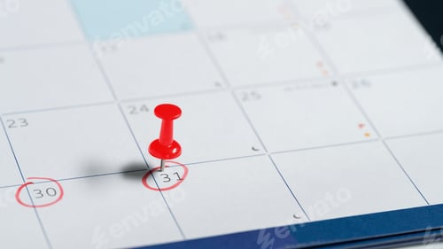 Preview: Red push pin marking the 31st day on calendar, symbolizing an important date or deadline