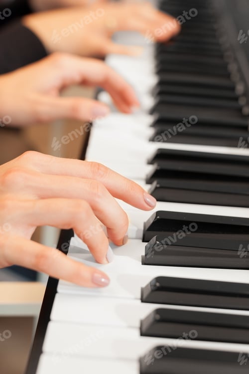 Preview: Closeup of hands playing piano. Music and hobby concept