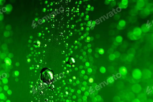Preview: Abstract green raindrop background with beautiful bokeh. Many shades of green.