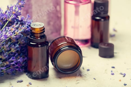 Preview: Lavender essential oils and bottles on a simple surface with natural decor elements
