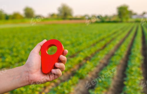 Preview: Red location pin on farm field.