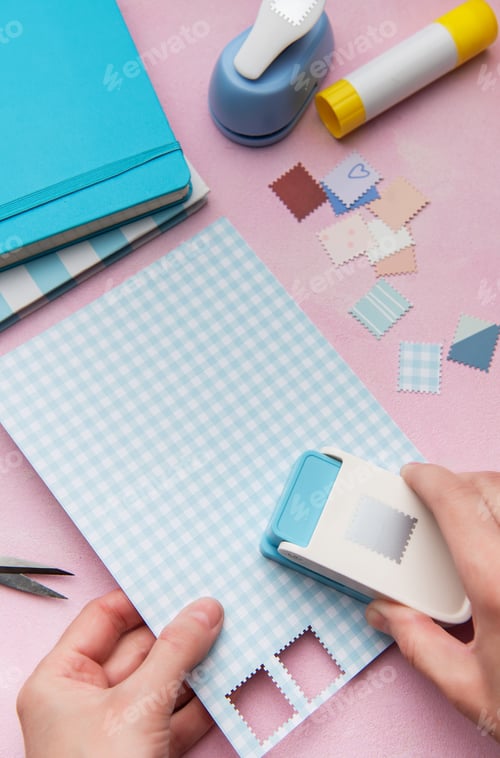 Preview: Hand using punch tool creating decorative craft stamps