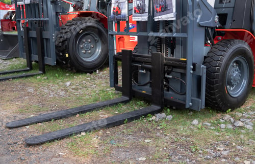 Preview: Industrial forklift with durable tires and metal forks.