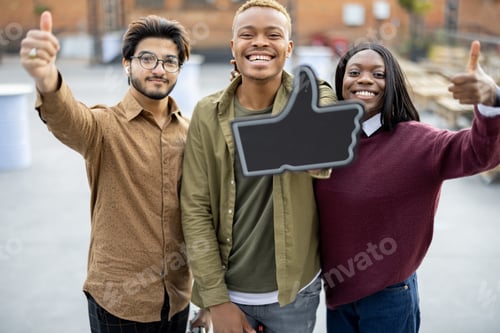 Preview: Guy hold phone and show thumb up with friends
