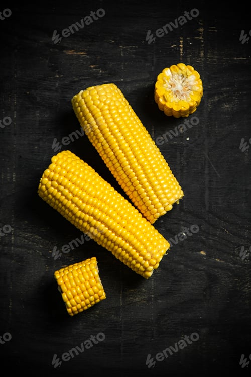 Preview: Corn on dark table.