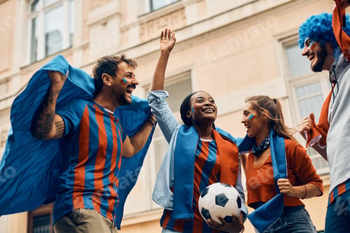Preview: Below view of cheerful soccer fans celebrating victory of their team.