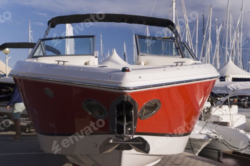 Preview: Closeup shot of a red and white boatin the harbor of Mallorca, Spain