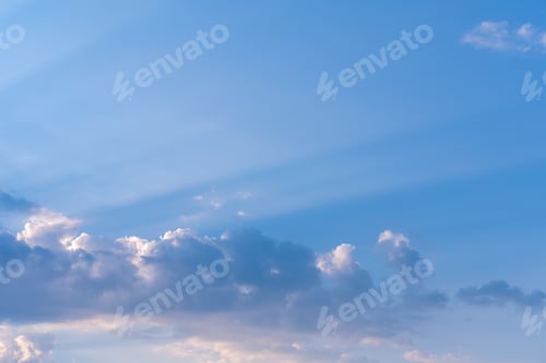Preview: Evening sky with illuminated clouds, amazing sunset and majestic sunlight breaking through clouds