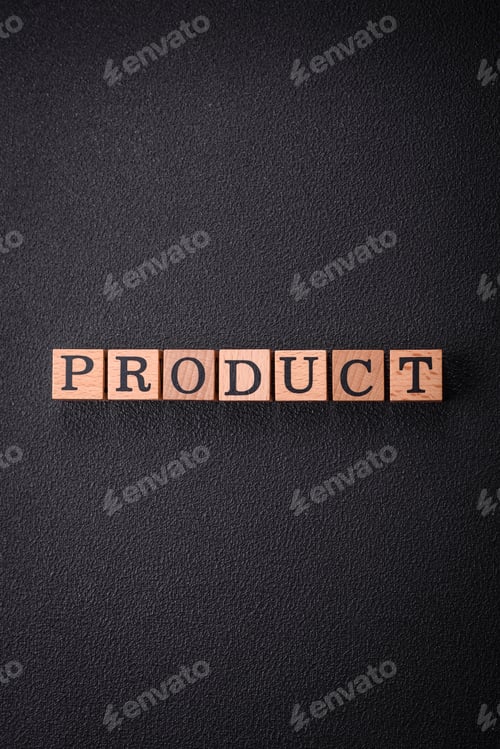 Preview: The inscription product with wooden cubes on a dark concrete background