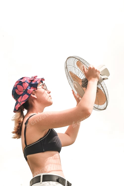 Preview: Heat,abnormal heat,woman cooled by fan mobile fan,heat stroke,heat protection,extreme heat,extreme w