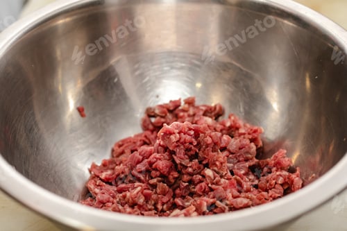 Preview: Chef preparing steak tartar of old cow sirloin with 40 days of maturation on restaurant