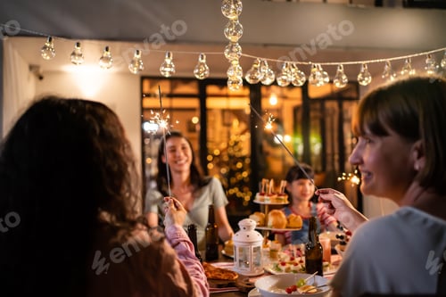 Preview: Multi-ethnic family celebrate weekend reunion gathered together, enjoy party outdoors in the garden.