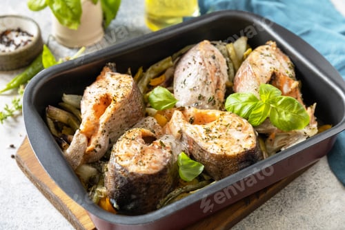 Preview: Healthy baked fish salmon steaks with basil, green beans. Cooking a delicious low carb dinner.