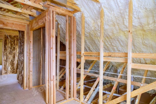 Preview: Under roof of a new frame house, thermal foam insulation is installed for insulation purposes