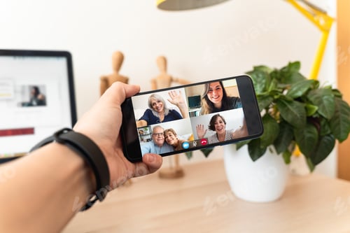 Preview: Father mother and daughters talking in video conference at home during coronavirus lockdown