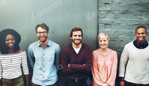 Preview: We stand up for diversity. Shot of a diverse group of people standing together against a gray wall.