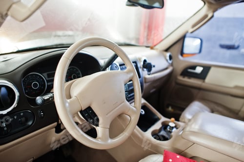 Preview: Interior of American SUV car on stand in workshop of service station.
