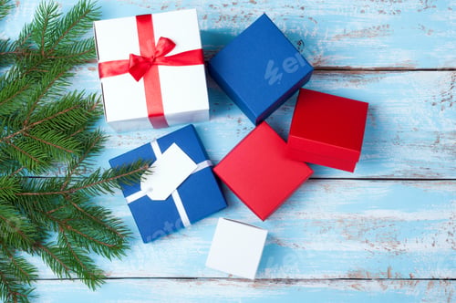 Preview: Gift boxes. Gift presents and christmas tree on wooden background