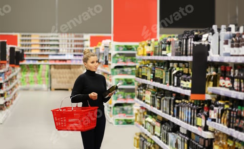 Preview: Woman Choosing A Dairy Products At Supermarket