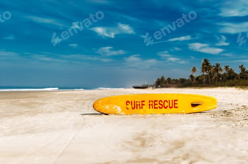 Preview: Life saving yellow board with surf rescue sign. Rescue surf board