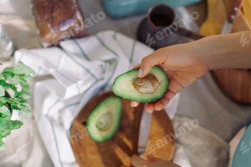 Preview: Avocado Preparation on Wooden Cutting Board
