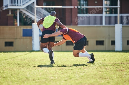 Preview: Rugby, sports and tackle with a team on a field together for a game or match in preparation of a co