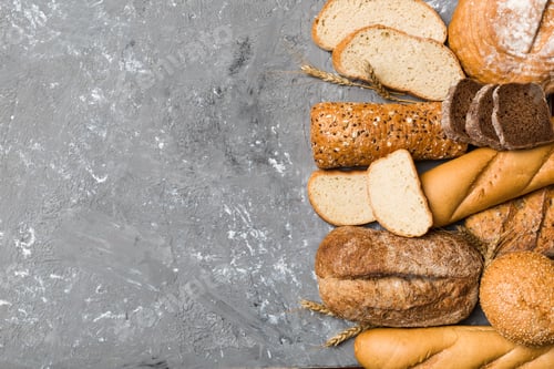 Preview: Homemade natural breads. Different kinds of fresh bread as background, top view with copy space