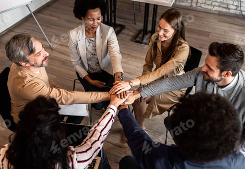 Preview: Group of diverse group of business people having a meeting while sitting in circle.