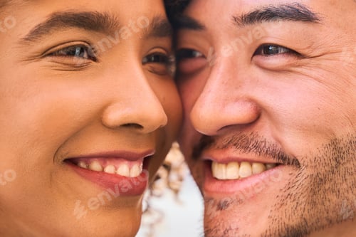 Preview: Happy multiracial couple smiling and showing love