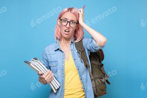 Preview: Young caucasian woman with glasses scratching head, thinking deeply about something