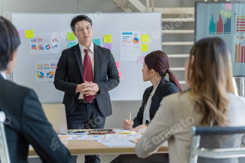Preview: A group of young Asian businessmen Talking
